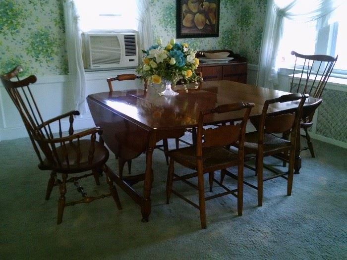 Hitchcock chairs and Nichols and Stone Windsor Chairs featured with drop leaf table.