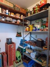 Gardening items in storage room off of garage