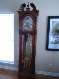 Howard Miller "Big Bertha" illuminated grandfather clock.  One side glass panel is broken-easily replaced. 