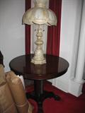 round table and ornate lamp