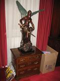 statue and chest of drawers