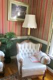 One of two chairs that go with the Antigue 3 piece set from Belgium.  Once you sit in it you will not want to get up.