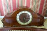 This vintage mantel clock is directly from Belgium.  The sleek lines and rolled edges fit with any decor.  What a regal piece.