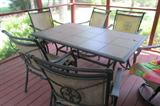 7 piece Patio set with tiled table in excellent shape. Has been stored in enclosed screened porch and is a necessity for any great party or for having friends and family gather around at meal times outdoors. A great find!