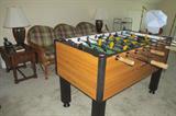 Want to play?  This Tornado Foosball commercial-grade Cyclone II has all the solid construction and performance features of the Tornado coin-operated table in an attractive cabinet for the home. Solid maple wooden handles Chrome plated, .156" thick, hollow steel rods resist bending and withstand abuse. Solid commercial-grade legs will not warp or split.  Adjustable leg levelers make installation and leveling easy on uneven floors  
 Thick and sturdy 1 1/2" cabinet construction helps prevent the table from moving during aggressive play. Attractive teak laminate cabinet.  Approximately 56" long  x 30" wide x 36" tall