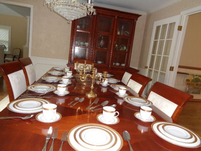 Baker dining room set with 12 place setting Noritake china and yakima 10 place setting flatware set.