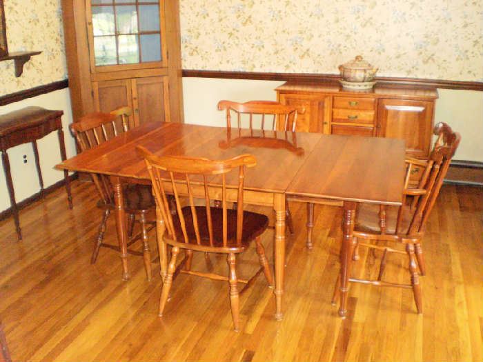 Dining room table with 6 chairs, four shown