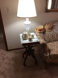 Marble top tables - crystal lamps - little boy vintage straw hats - International Harvester