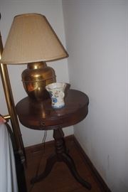 Duncan Phyfe style round table and brass lamp