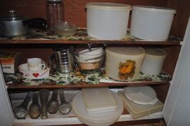 Lots of Tupperware and kitchen items.  Those round ones are nesting sets!