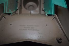 Maker on bottom of chair and dryer