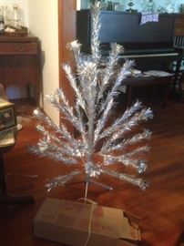4 foot silver tree with original box and packaging