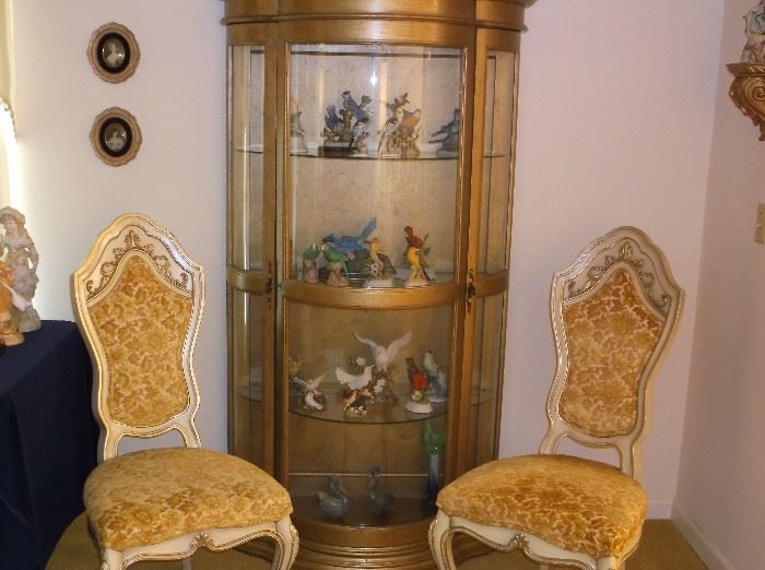 Bow front curio cabinet and dining chairs