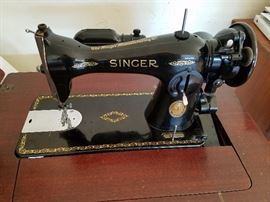 ELECTRIC SINGER SEWIG MACHINE, PRODUCED IN 1952, GOOD CONDITION IN SEWING MACHNE CABINET  $150 