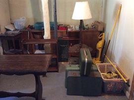 repurposing furniture pieces , bookshelf, vintage hard case suitcases.