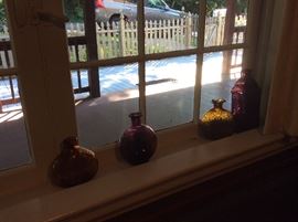 some bottles where they have sat for years like jewels in a window