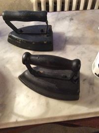 Heavy irons on one of the marble slabs used for an alternate table top