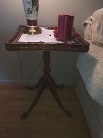 Four legged vintage side table with leather top