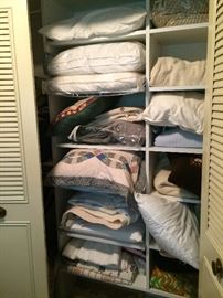 Many linens, pillows, tablecloths, quilts, napkins and vintage lace