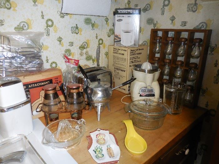 Spice Rack/Jars, Sunbeam Juicer. Farberware Coffee Pot , Pyrex Syrup Warmers. Spoon Rests
