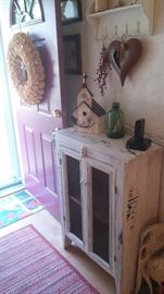 Hall cabinet with unique collectibles