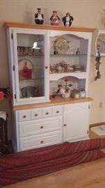 Beautiful white and maple kitchen cabinet filled with treasures