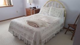 Double bed with elegant brass headboard