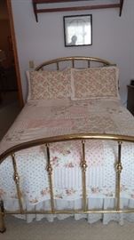 Double size brass bed with front and bottom brassware