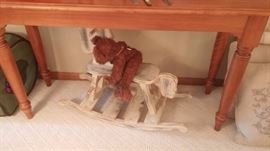 Stuffed animals and small rocker
