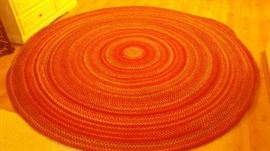 another braided rug - this one is bright orange and rounded