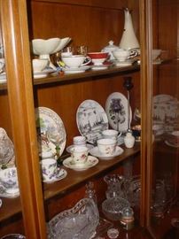 Some of the cup and saucer sets, plus other collector plates