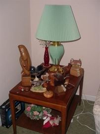 One of a pair of the mid century end tables, this one loaded with many collectibles, and one of the pair of early lamps...note the early Christmas figure on bottom shelf