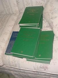 There are several sets of coin books, filled with pennies, nickels, dimes, etc.