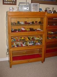 One of the oak barrister cases, all filled with cars, or early airplanes