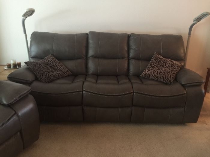 Like New, Auto Reclining Leather Sofa with two matching recliners ( color is a light brown) like new condition 