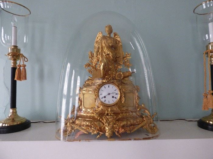 French Ormalu clock in glass dome.  Wooden base is available)  Great Gatsby Auction House estimates value at $3500-4500.  Family history says the clock came into the Carolinas in Seventeenth Century with the French Huguenots. 