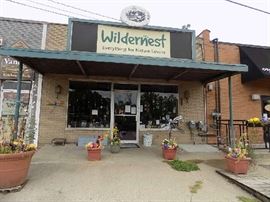 The signs on both the front and the back of the store are for sale.