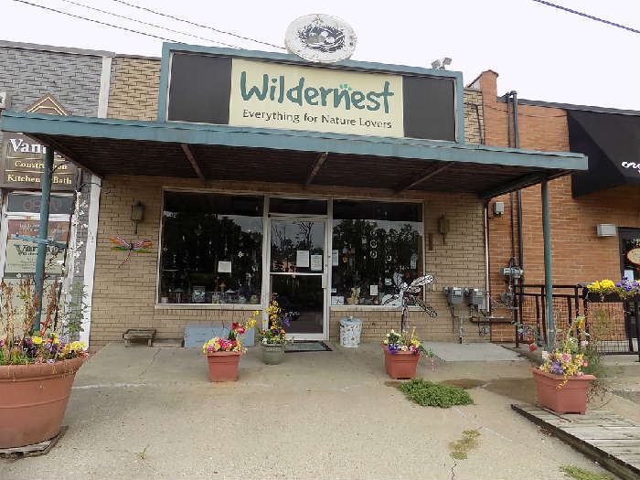 The signs on both the front and the back of the store are for sale.