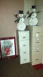 Basement.....metal snowmen, filing cabinets, poster.