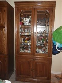 Display cabinet with storage on bottom