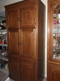 Entertainment cabinet with storage and pull out shelves