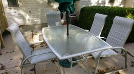 Patio table with 4 chairs and umbrella