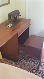 Vintage sewing machine cabinet with built in chair
