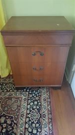 Vintage sewing machine cabinet with built in chair