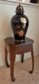 Lindner porcelain urn on a solid oak table by Brandt furniture