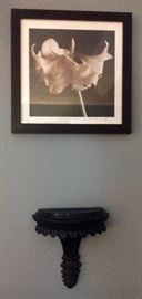 Black sconces, flower photos