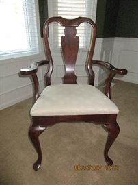 Two Captain/armed upholsteed chairs of the six