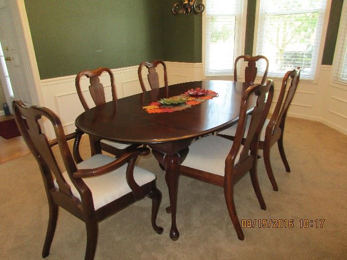 Dining room table and six upholstered chairs