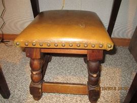 Small leather stool with nail head accent