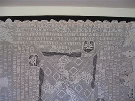 Various names surround this historical hand crocheted spread.